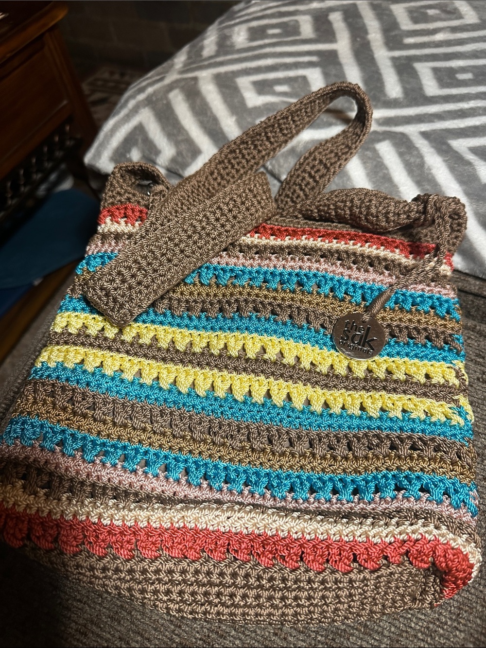 The Sak Striped Crochet Shoulder Bag in Brown, Blue, Yellow, Coral, Cream